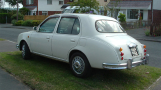 Illustration for article titled Miniature Nissan modified to look like vintage Jaguar on Ebay